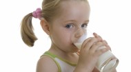 Little girl drinking milk