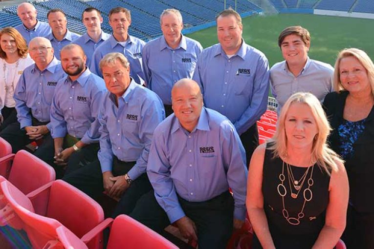 The Reese Group today employs more than 500 people, including a talented management team. Back row, from left: Brian Buckner, national retail sales manager; Mike Schmit, Northeast business manager; Nathan Richards, Southeast retail sales manager; Don Alldredge, Southwest regional VP; Phil Otto, Central regional VP; Matt Reese, Military VP; Michael Reid, business manager/analyst, Nashville; and Rhonda Sweeney, accounting operations manager. Front row, from left: Mike Prescott, division VP, Kingsport; Nikki Johnson, business manager; Tom Jessee, Southeast regional VP; Ryan Reese, VP; Steve Lyons, VP, Dollar/Discount; Darrell Reese, company president; and Rhonda Holmes, CFO.