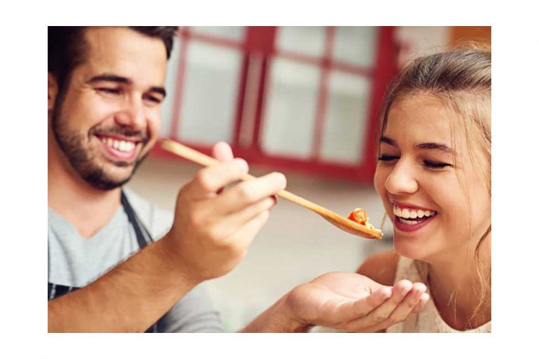 A couple preparing dinner