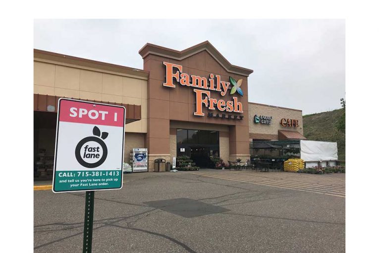 A Family Fresh Market with Fast Lane signage