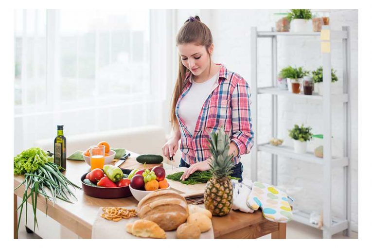 A young woman preparing dinner