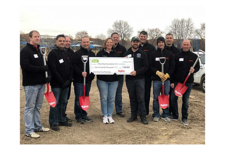 Hy-Vee representatives presented a check to the Arbor Day Foundation.