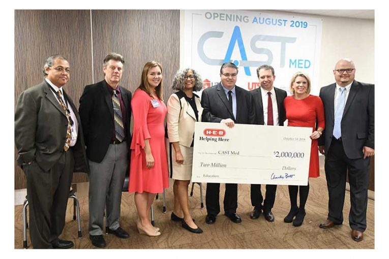 H-E-B representatives present a $2 million check for CAST Med High School.