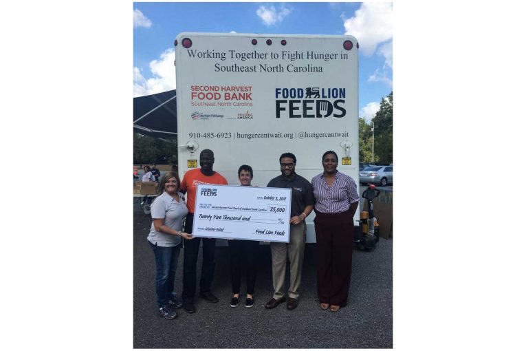 Food Lion presents a check for Florence disaster relief.