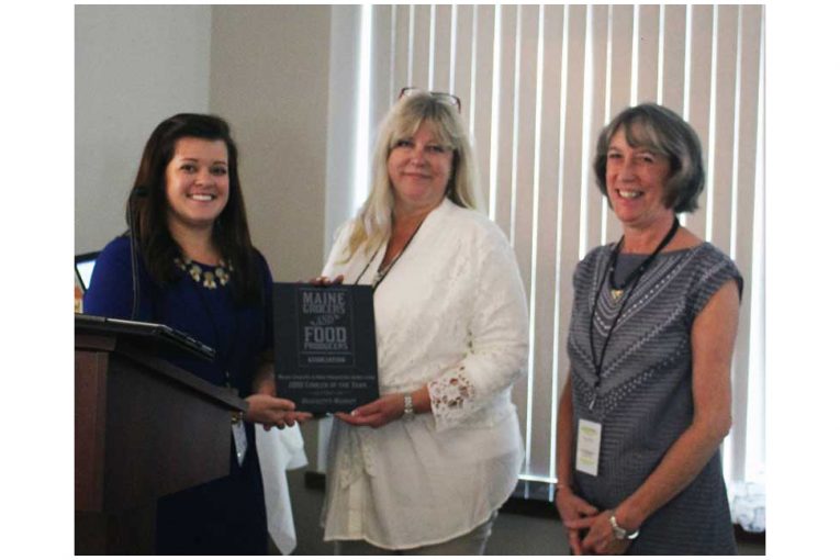 Christine Cummings, MGFPA executive director; Kim Brackett, Brackett's Market and winner of the 2018 Grocer of the Year award, and Cathe Morrill, MGFPA president.