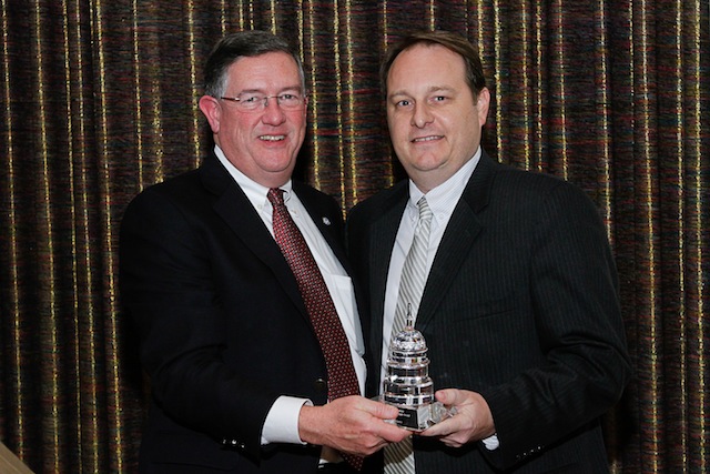 Jason Cooper, right, of Brookshire Grocery Co. is the NGA Clarence G. Adamy Award recipient. He is pictured with NGA's Peter Larkin.