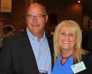 Scott Boll, Kemps, and his wife, DeeAnne Boll.