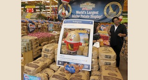 Spuddy Buddy poses for a picture on one of the couches constructed of 10-pound Idaho potato bags that were featured in the display.