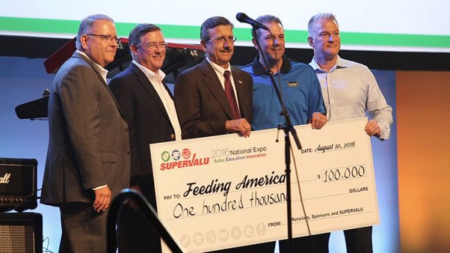 Supervalu presents Feeding America with a check for $100,000 as part of its 2016 expo.
