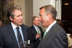 Davis talks with former Speaker of the House John Boehner at the NGA Show in February 2017.