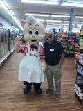 Tommy Coogle with Mr. Pig, Piggly Wiggly’s beloved mascot.