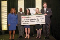 Ralphs contributes to the community. From left: Myeisha Gamino, Victor Smith, Vanessa Rosales and Valerie Jabbar of Ralphs; Michael Flood, CEO of the Los Angeles Regional Food Bank.