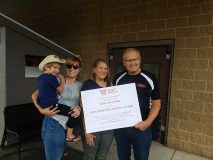 WGA Community Service Award winner Doug Kulinski of Iola Sentry with his family.