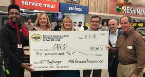 MGA President Jamie Pfuhl (third from left) and Chad Ferguson (second from right) presented PROP with a $1,000 donation on behalf of the 2017 Bag Hunger Campaign.