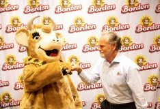 Borden CEO Tony Sarsam with Elsie the Cow.